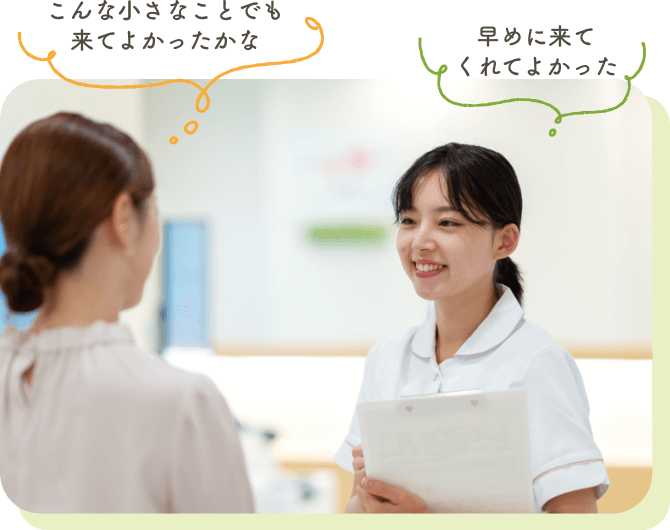 話を聞く受付の女性スタッフ